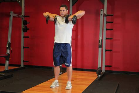 The upright row can be performed with a wide grip (as described above) or a narrow grip. Standing Dumbbell Upright Row Exercise Guide and Video