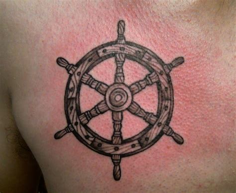 Tiny ship wheel tattoo on the wrist. Collin Kasyan's Tattoo Portfolio: July 2010