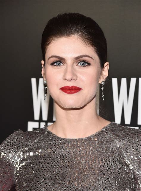 A Woman With Blue Eyes And Red Lipstick Wearing A Silver Dress At The W