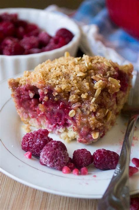 A Piece Of Raspberry Crumb Pie On A Plate