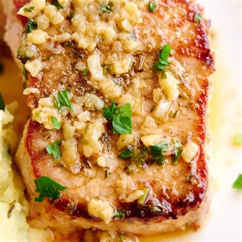 Pour a tablespoon or so of olive oil on each pork chop and spread it evenly. Baked Pork Chops with Browned Garlic Butter - Craving Tasty