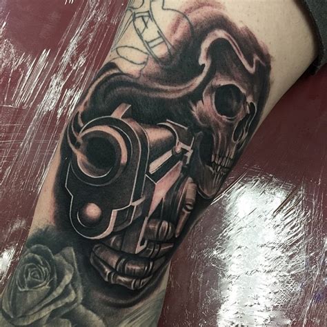 This tattoo definitely scores brownie points for innovative conceptualization. Skeleton Gun Tattoo ~ Tattoo Geek - Ideas for best tattoos