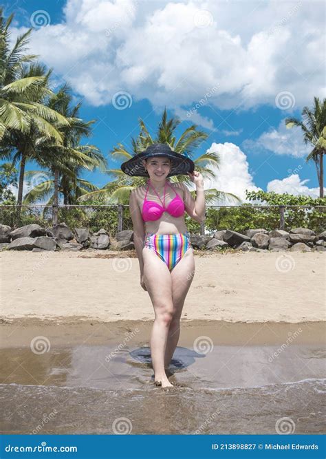 A Pretty And Carefree Asian Lady At A Tropical Beach Posing With Her New Bikini At Nasugbu