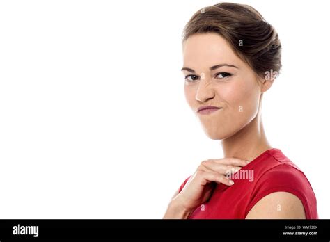 Pretty Woman Making Mischievous Face Expression Stock Photo Alamy