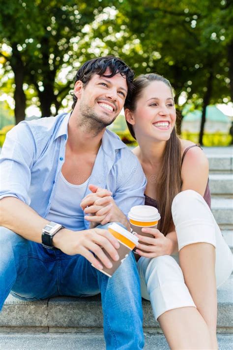 Young Couple In City Park Drinking Coffee Stock Image Image Of