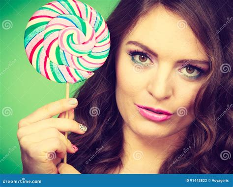 Smiling Girl With Lollipop Candy On Green Stock Photo Image Of Smile