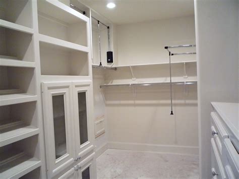 The funny thing is, i feel like by adding a fireplace and the built ins, it actually i went the practical route and put in a wardrobe closet to add some extra storage for linens and the cable box. Custom master closet built-ins for new custom home in ...