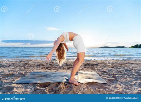 Young Woman Practicing Yoga Exercises Standing Backbend Stock Image