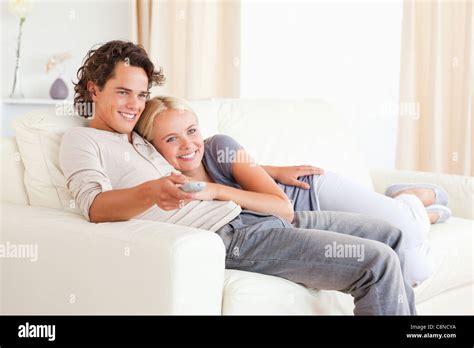Couple Cuddling While Watching Tv Stock Photo Alamy