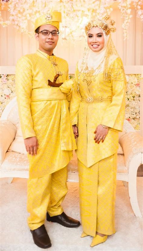 Malay Groom Bride Wearing Yellow Coloured Traditional Songket Dress