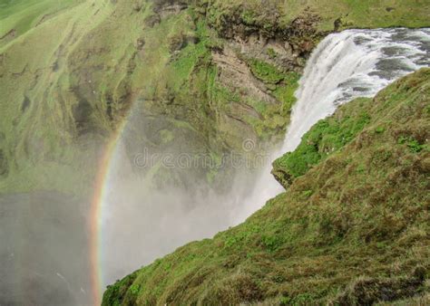 Skogafoss Waterfall With Beautiful Rainbow On Sunny Day South Coast Of
