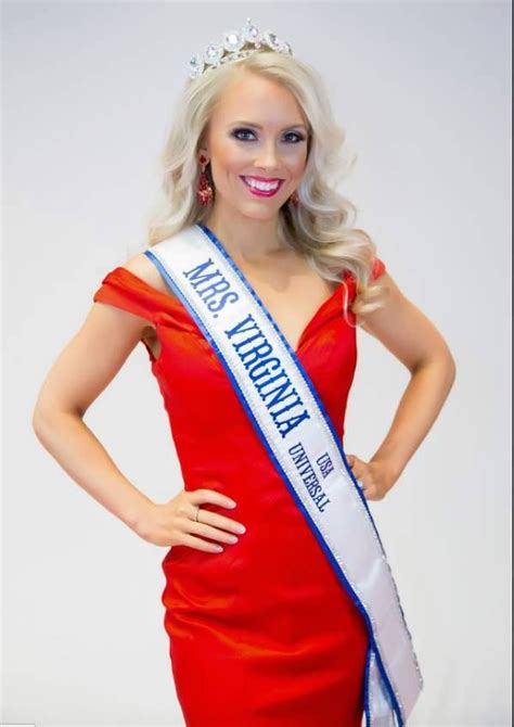 A Woman In A Red Dress And Tiara Posing For The Camera With Her Hands