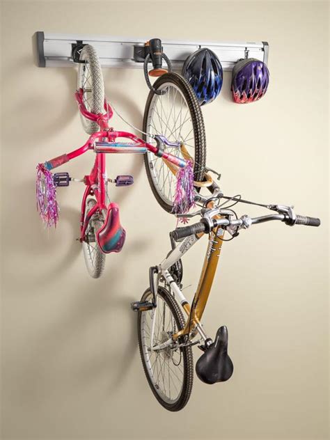If i'm understanding that correctly, it seems like this would be functionally similar without the need to weld it yourself: 11 Garage Bike Storage Ideas | DIY