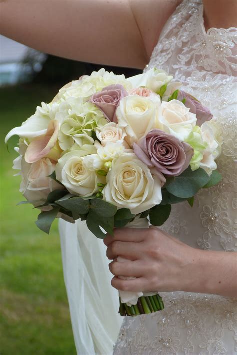 A Vintage Inspired Pastel Bridal Bouquet Including Amnesia Roses