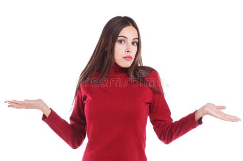 Девушка удивлена с ее руками на предпосылке изолированной белизной Стоковое Изображение