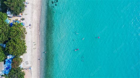 Free Photo Aerial View Of Sandy Beach With Tourists Swimming