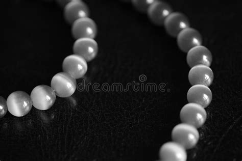 Stone Necklace On A Dark Background Black And White Stock Image