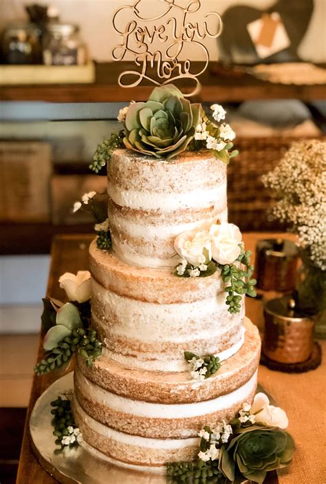 naked wedding cake with succulents baking