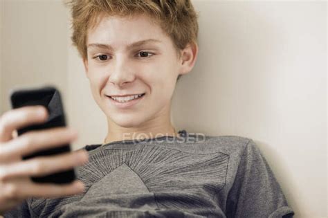 Teenage Boy Using Phone — Bearing Close Up Stock Photo 222922232