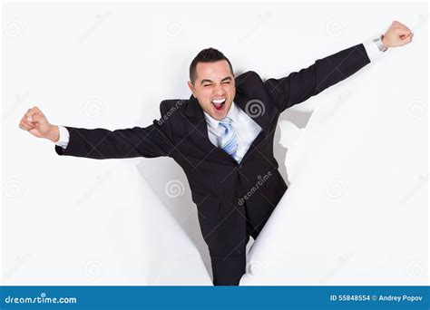 Successful Businessman Breaking Through White Wall Stock Photo Image