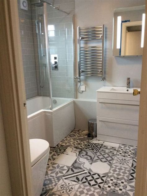 A wood floor and vanity give this city bathroom a warm and serene feeling. Style up your Ordinary Bathroom with These Spanish Tile ...