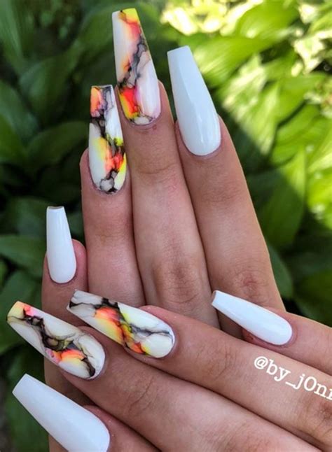 Stone explains that as long as a nail technician is keeping a color symmetrical and very clean around the edges, a darker, bolder color can work on a short and wide nail. #nailsclassy #neutral #acrylic #glitter #designs #coffin # ...