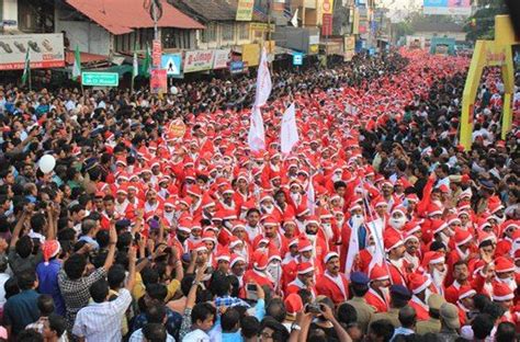 Thousands Of Santa Clauses Parade Through The Streets Of Thrissur