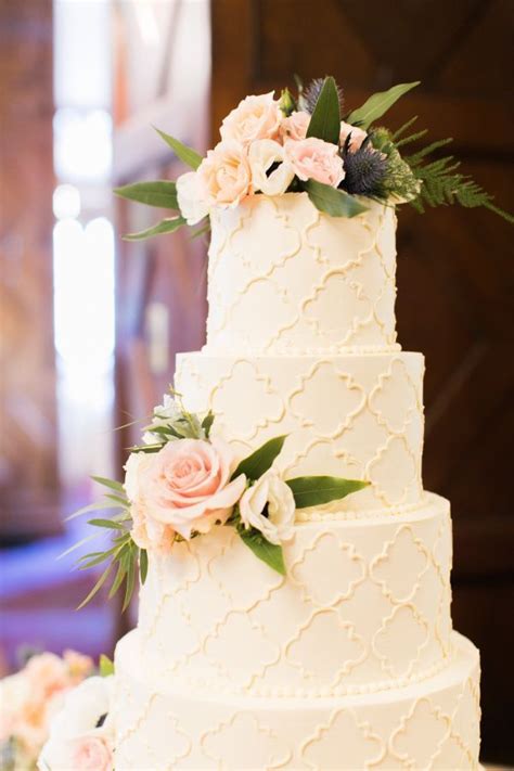 Four Tier Floral Topped Wedding Cake