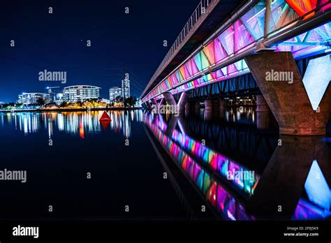 Night Shot Of Tempe Town Lake With The Famous Rainbow Colored Bridge In