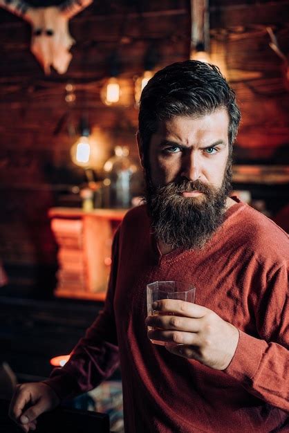 Premium Photo Attractive Man With Glass Of Whiskey In His Hands Drink