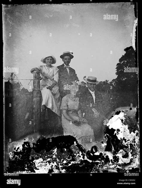 Two Couples Sitting On A Fence Fashion 1890s Stock Photo Alamy