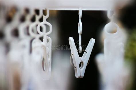 White Hanging Cloth Clippers On The Rack Stock Photo Image Of Work
