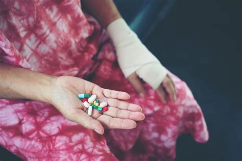 Woman Hand Holding A Pills Take Medicine According To The Doctors