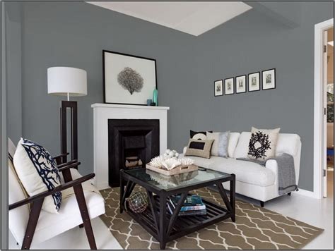 This formal living room is painted white and is brought to life by gold accents, seen in the light fixture, ottoman and artwork. Light Paint Colors for Living Room — Foothillfolk Designs