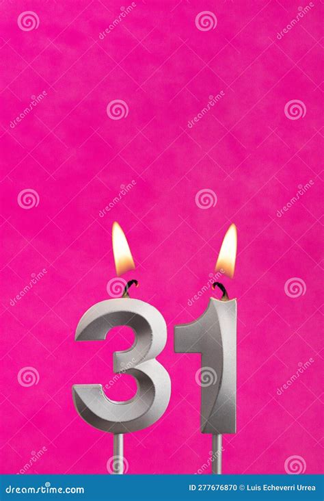 Candle 31 With Flame Silver Anniversary Candle On A Fuchsia