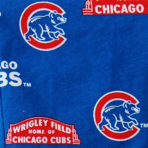 Chicago Cubs Logo On The Back Of A Blue T Shirt With Red And White Logos
