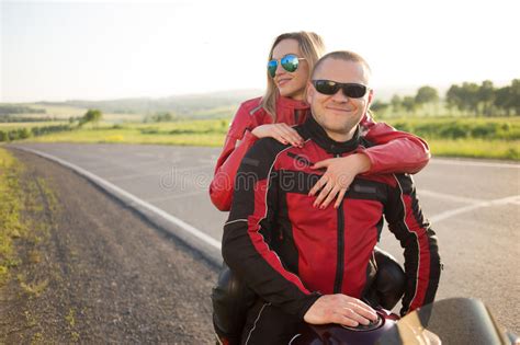 Biker Man And Woman Sitting On A Motorcycle Stock Photo Image Of
