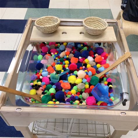 Pompoms In The Sensory Table