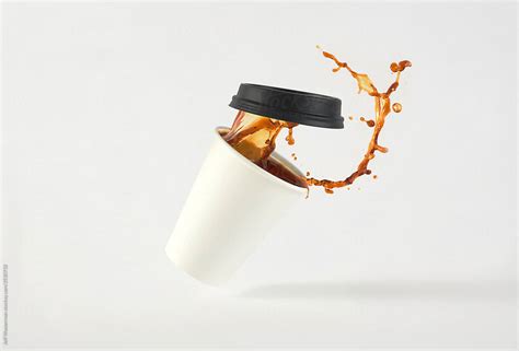 Coffee In Paper Cup Splash By Stocksy Contributor Jeff Wasserman