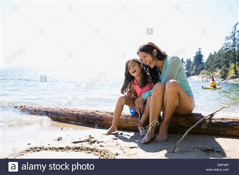 Mother And Daughter Hugging On Sunny Beach Stock Photo Alamy