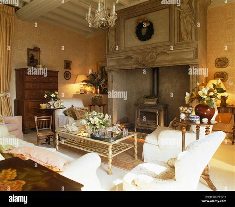 Ornate Carved Wood Fireplace With Wood Burning Stove In French Country