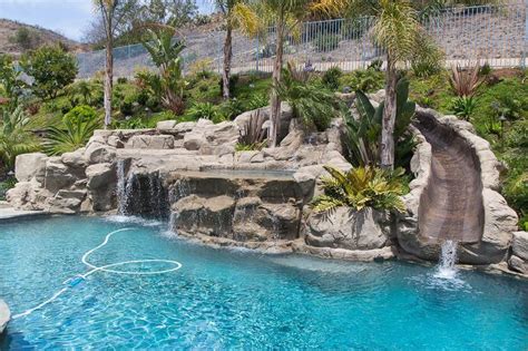 Rock Swimming Pool With A Water Slide Spa Waterfalls
