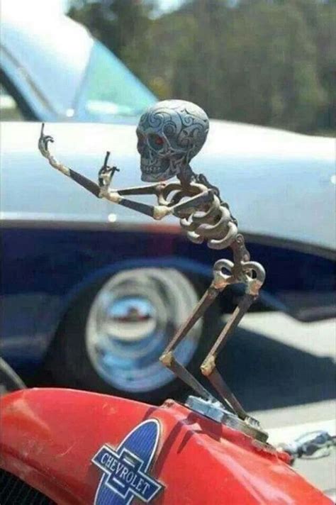 That's not a hood ornament, although you probably could use it as one. Skeleton hood ornament | Hood ornaments, Cool cars, Rat rod