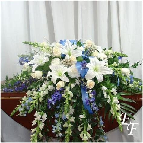 Funeral flowers with springtime colors are optimal because spring is often associated with rebirth and hopefulness. Peaceful Blues Casket Spray EF-207 A | Essex Florist ...