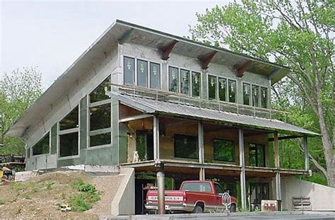 Single slope roof with porch. Stainless steel house ...