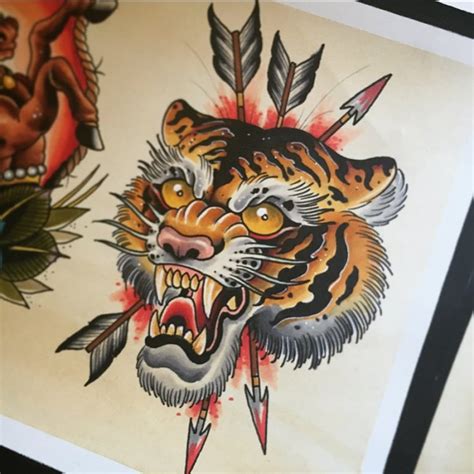 There are people who use tattoos to convey a message beyond words and actions. Traditional tiger head pierced with a lot of arrows tattoo ...