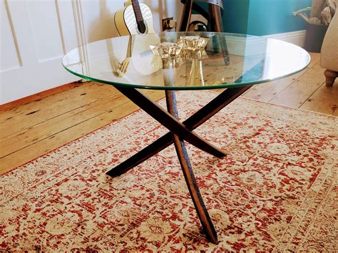 Contemporary glass top coffee table made from reclaimed
