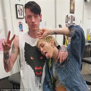 Miley Cyrus Turns Tattoist As She And An Artist Take It In Turns To Ink