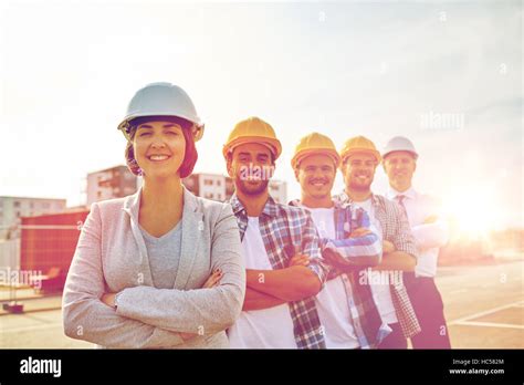 Happy Builders And Architect At Construction Site Stock Photo Alamy