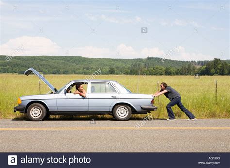 Man Pushing Broken Down Car Stock Photo 14309451 Alamy